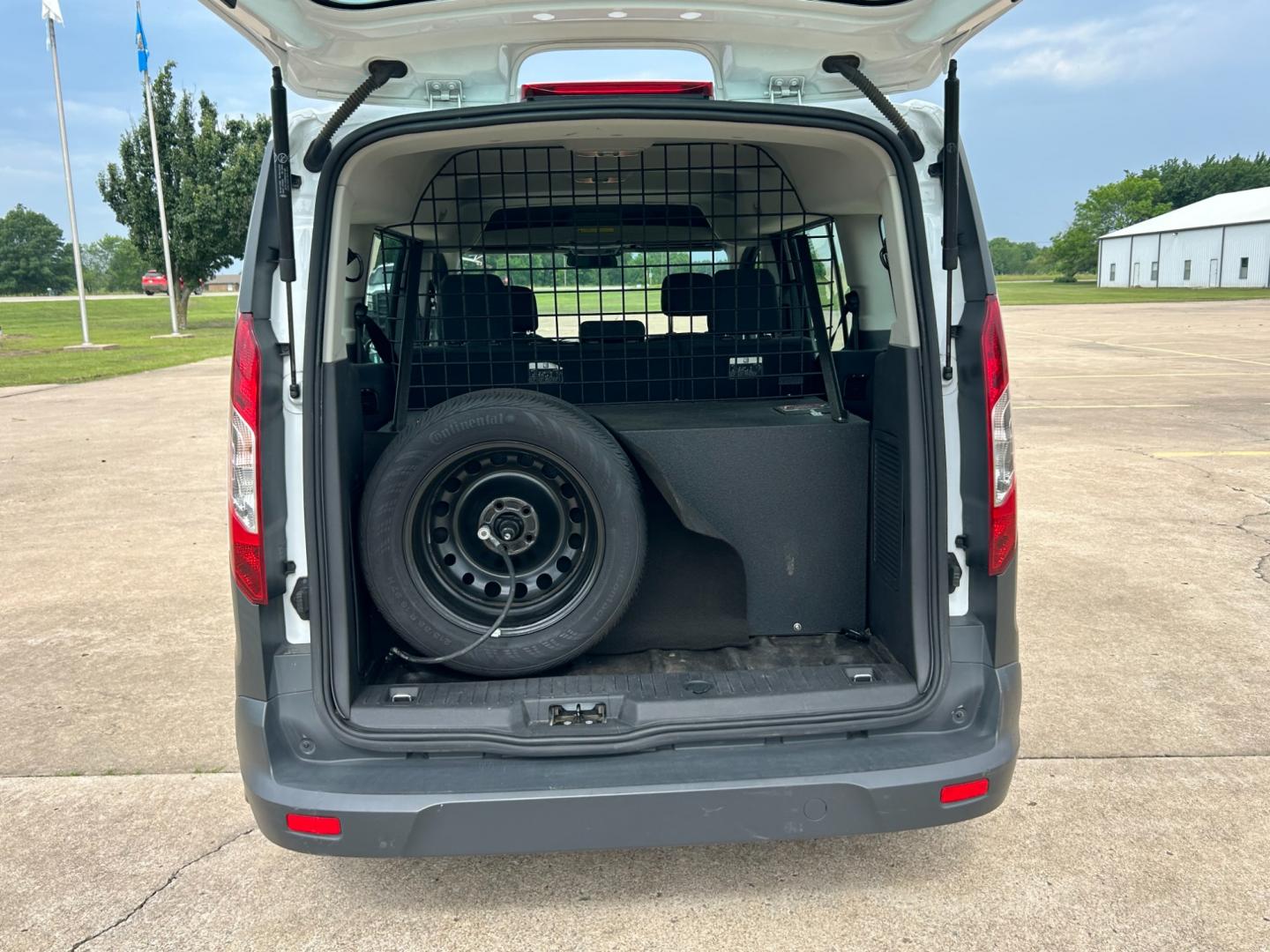 2014 White /Gray Ford Transit Connect Wagon XL w/Rear Liftgate LWB (NM0GE9E75E1) with an 2.5L L4 DOHC 16V engine, 6-Speed Automatic transmission, located at 17760 Hwy 62, Morris, OK, 74445, (918) 733-4887, 35.609104, -95.877060 - 2014 FORD TRANSIT CONNECT HAS 2.5L ENGINE, FEATURES POWER LOCKS, POWER WINDOWS, POWER MIRRORS, AM/FM STEREO, CRUISE CONTROL, BLUETOOTH HANDS-FREE CALLING, BACKSEAT,IT RUNS ON CNG (COMPRESSED NATURAL GAS) OR GASOLINE. A PREMIER ALTERNATIVE FUEL CONVERSION THAT IS EPA-APPROVED. EXTREMELY CLEAN-BURNING - Photo#17